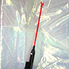 Image of a cattle prod laying on cellophane